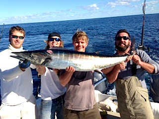 Photo courtesy of Capt. Chris PageOffshore action this past weekend produced this wahoo along with a mahi and several blackfin tuna. Shown are, from left, Kent Phillips, Brendin and Zack Page and Johnny Gold.