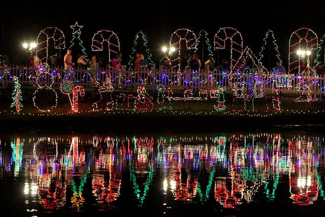In this file photo, the lights shine during the annual Pond Lighting Ceremony at North Florida Regional Medical Center on Friday Dec. 6, 2013.