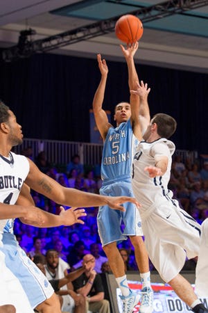 North Carolina's Marcus Paige takes a 3-pointer over Butler's Tyler Wideman last week during a loss.