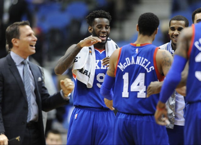 The 76ers' JaKarr Sampson (9) congratulates fellow rookie K.J. McDaniels (14) during the fourth quarter of Wednesday's 85-77 win over the Timberwolves after starting the season with 17 losses.