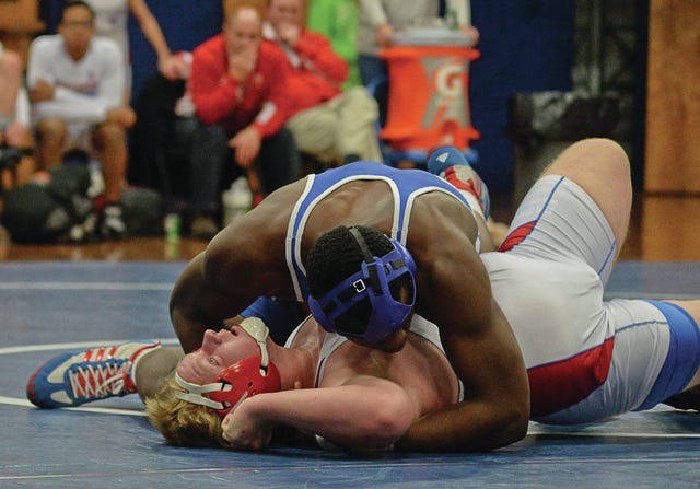 Asheboro's Nicholas Coe pins his Southern Alamance opponent during a Tri-match at Asheboro on December 4th,2014. PJ Ward-Brown/The Courier-Tribune