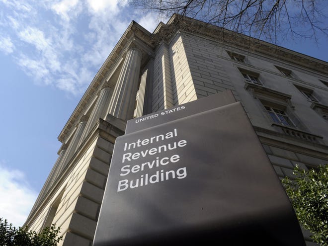 The exterior of the Internal Revenue Service (IRS) building is seen March 22, 2013, in Washington. The House rushed through a last-minute measure Wednesday to extend a massive package of expired tax breaks for banks, investment firms, commuters and NASCAR track owners.