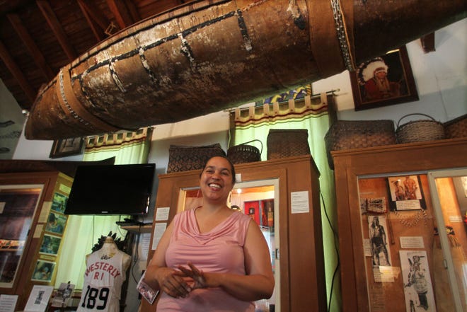 A birch bark canoe made by distant relatives in her family hangs above Lorén Spears, director of the Tomaquag Museum in Exeter.