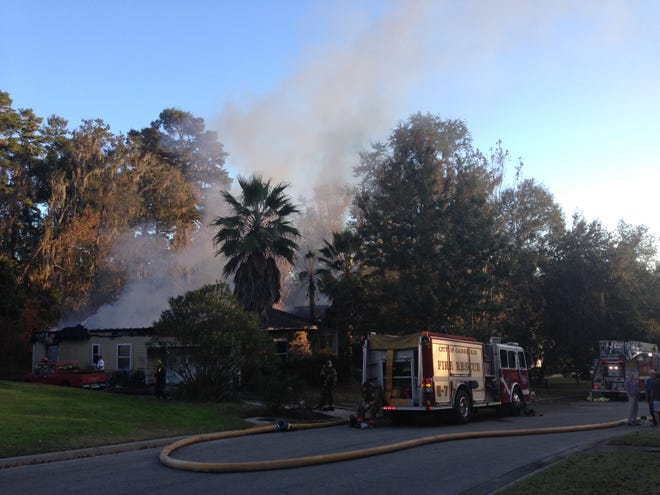 Gainesville Fire Rescue attends to a fire that destroyed a northwest Gainesville home and likely killed three dogs inside late Thursday afternoon.