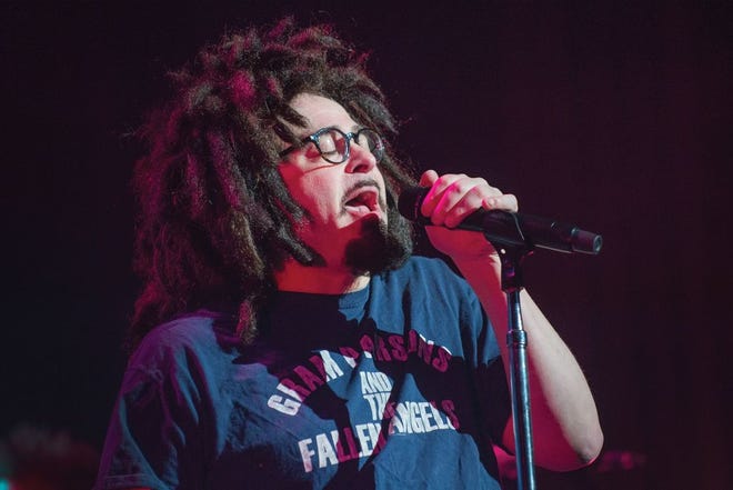 Adam Duritz, frontman of Counting Crows, performs Thursday night at the Peoria Civic Center Theater. The rock band performed to a packed crowd in support of its new album "Somewhere Under Wonderland."