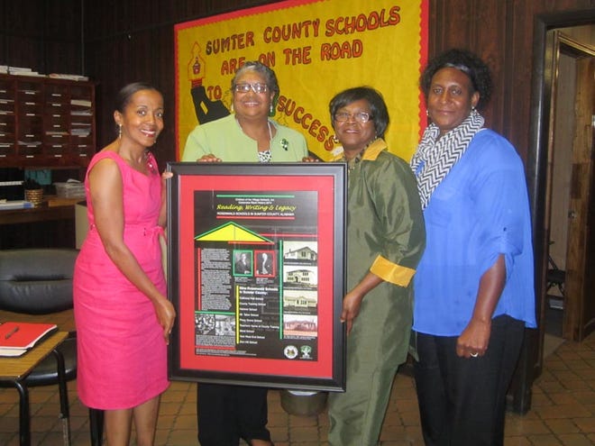 At the Sumter County Board of Education, (left to right) COTV Chairman and District Court Judge Tammy Montgomery, Superintendent of Education Katie Jones-Powell, Board of Education Chairman Tommie Campbell and Sumter CJPO Cora Hutchins chronicle their experiences with Rosenwald Schools. COTV's poster and "Share your Stories" cards were presented to that office.