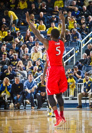 NJIT guard Damon Lynn (5) reacts to making a 3-pointer in the second half of his team's win against Michigan at Crisler Center in Ann Arbor, Mich., Saturday. Photo by AP.