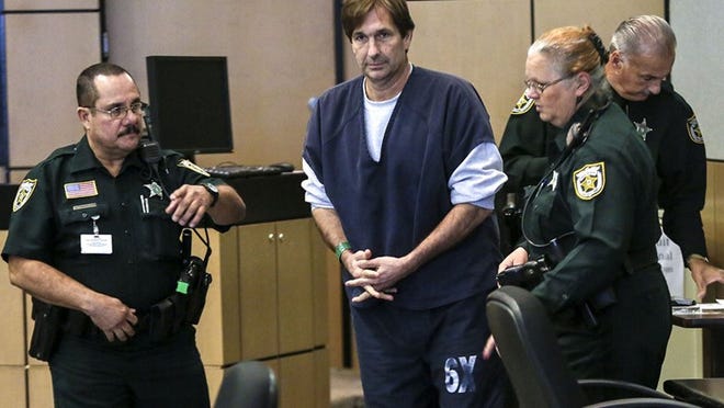 John Goodman is escorted to his seat after being fingerprinted Friday, November 21, 2014 before his sentencing in the death of Scott Wilson. Goodman was sentenced to 16 years in prison and is being held without bond for DUI manslaughter. (Lannis Waters / The Palm Beach Post)