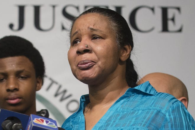 Esaw Garner, wife of Eric Garner, attends a news conference at the National Action Network headquarters in New York on Wednesday after a grand jury's decision not to indict a New York City police officer involved in her husband's death.