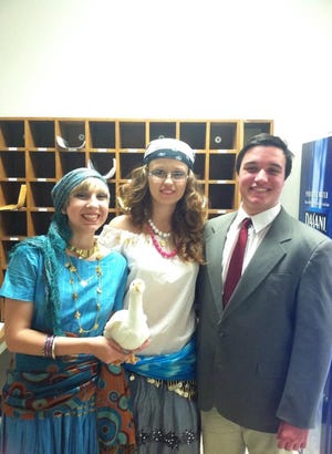 Ukrainian exchange student Kateryna Solodovnyk, 17 (middle) pictured with co-stars Danielle Simpkin (left) and Nathaniel Sylvia (right) in Apponequet Regional High School's fall production of Ducks and Lovers where she played the character of "Aunt Rosa". 

Submitted pictures