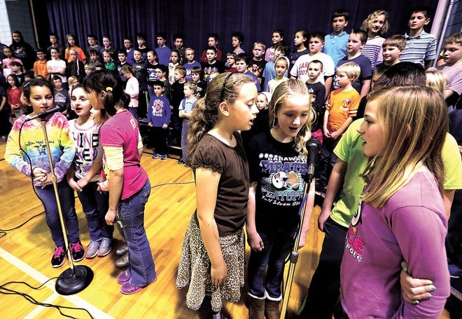 Dundee Elementary School students rehearse their Christmas program Friday afternoon at the school in Dundee.