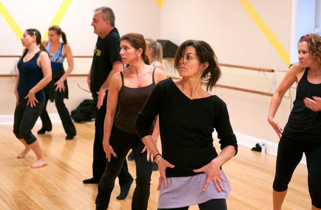 Rex Henriques teaches an adult jazz class at the Bucks County Dance Center in Bensalem Tuesday afternoon. Featured in this image (in foreground) is dancer Michele Dolaway from Ambler.