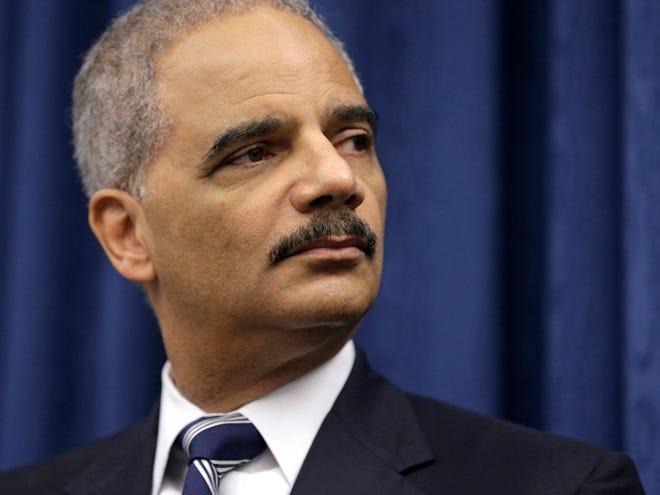 U.S. Attorney General Eric Holder speaks during a news conference on Dec. 4 before a roundtable meeting in Cleveland. The Obama administration issued guidelines Monday that restrict the ability of federal law enforcement agencies to profile on the basis of religion, national origin and other characteristics, protocols the Justice Department hopes could be a model for local departments as the nation tackles questions about the role race plays in policing.