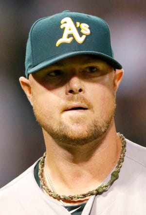 Former Red Sox ace Jon Lester, who was traded from Boston to the A's in July, chose to sign with the Cubs late Tuesday night rather than return to Boston.