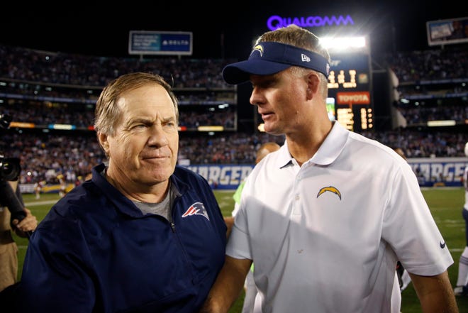 San Diego Chargers head coach Mike McCoy, right, and New England Patriots head coach Bill Belichick talk after the Patriots defeated the Chargers 23-14 on Sunday night in San Diego. AP Photo