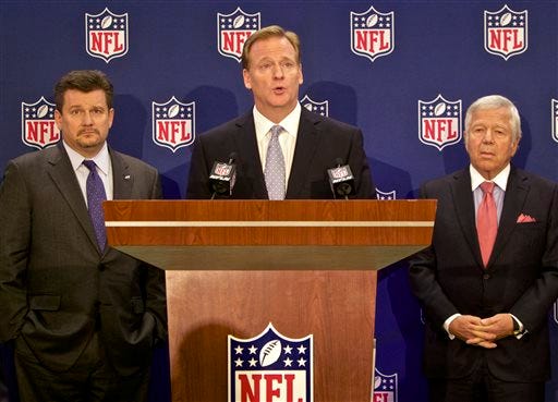 Arizona Cardinals President and Chairman of the NFL's new Conduct Committee, Michael Bidwill, left, and New England Patriots owner Robert Kraft, right, look on as NFL commissioner Roger Goodell, center, speaks at an NFL press conference announcing new measures for the league's personal conduct policy during an owners meeting, Wednesday, Dec. 10, 2014, in Irving, Texas. (AP Photo/Brandon Wade)
