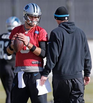 Carolina Panthers quarterback Derek Anderson, left, talks with quarterbacks coach Ken Dorsey, right, during an NFL football practice in Charlotte, N.C., Wednesday, Dec. 10, 2014. Anderson will replace starting quarterback Cam Newton on Sunday if Newton is unable to play after being injured in a car crash on Tuesday. (AP Photo/Chuck Burton)