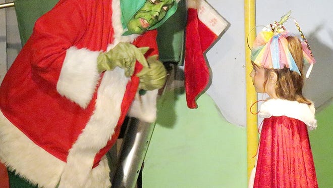 Live performances of How the Grinch stole Christmas, by Playhouse Smithville, was one of many activities during the Smithville Area Chamber of Commerce Festival of Lights celebration on Saturday.