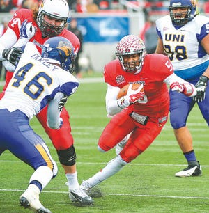 RON JOHNSON/JOURNAL STAR Illinois State quarterback Tre Roberson runs for a first down during Saturday's FCS second-round playoff win over UNI.
