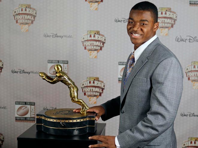 Alabama’s Amari Cooper stands with his trophy after being accepting the Biletnikoff Award for the nation’s most outstanding receiver at the College Football Awards on Thursday at in Lake Buena Vista, Fla. Cooper has 115 receptions for 1,656 yards this season with 14 touchdowns.