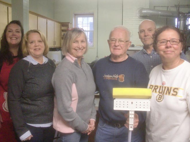 The Taunton Area Community Table Inc. nonprofit is setting up a "meal center" that will serve the poor and needy in the city starting next year. Volunteers including, from left, Michelle McMahon, Wendy Berry, Michaeline Saladyga, Ted Corr, Ed McNamara and Debbie Garnett help prepare the former St. John's Parish Hall on Bay Street.