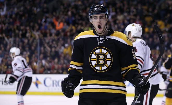 Bruins right wing Reilly Smith shouts in delight after scoring on Chicago Blackhawks goalie Scott Darling in the second period of Thursday night's game in TD Garden. CHARLES KRUPA/ASSOCIATED PRESS