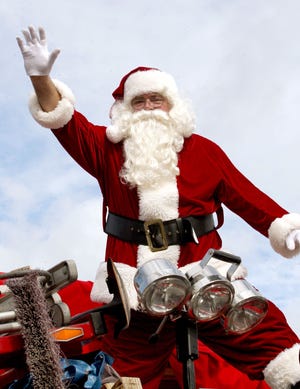 News-Journal file photo
Santa Claus will be on the road this weekend, appearing in numerous area holiday parades.