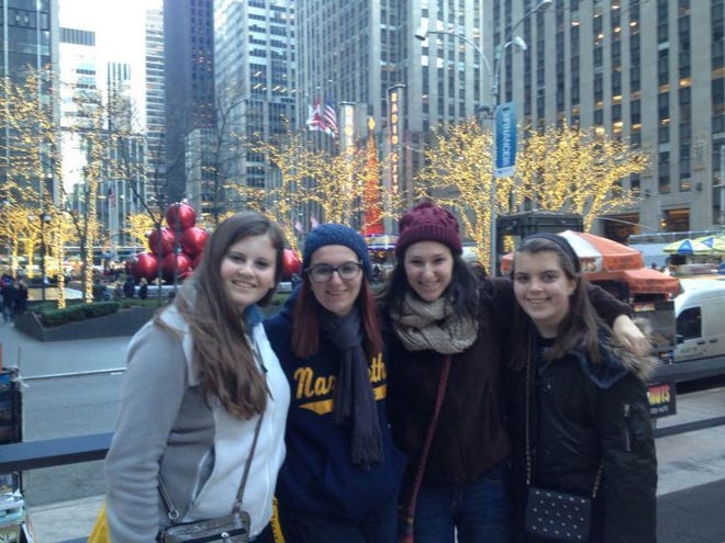Elizabeth (right) poses in front of Radio City Music Hall with Nazareth Academy friends (from left) Emily Cox, Cameron Kubach and Megan Nescio.