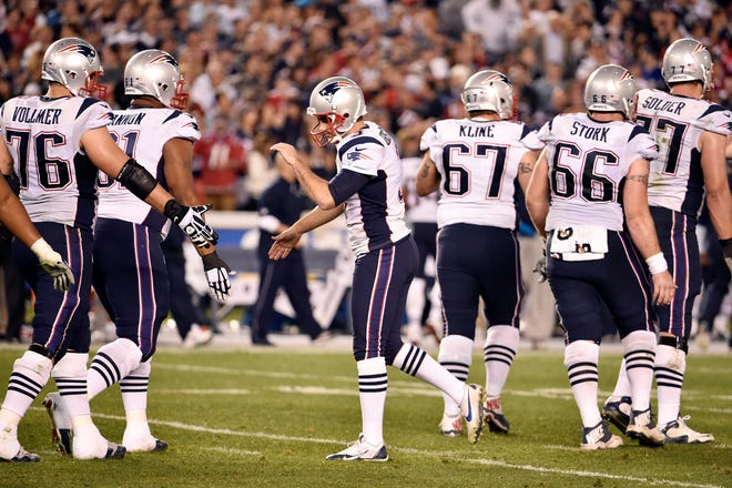 Patriots kicker Stephen Gostkowski (center) celebrates with teammates after hitting a field goal against the Chargers during the second half last Sunday. AP Photo/Denis Poroy