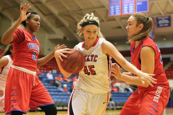 Hutchinson Community College’s Cynthia Petke, left, and Clemence LeFebvre defend against Northwest Tech’s Tailar Bremer during a game on Dec. 13.