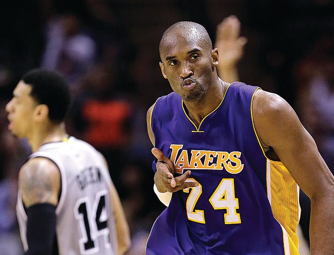 Los Angeles Lakers' Kobe Bryant celebrates after he scores against the San Antonio Spurs during the second half on Friday in San Antonio. Los Angeles won 112-110.