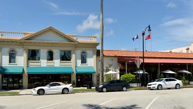 The Landmarks Preservation Commission in August unanimously agreed to consider for landmark designation the '20s-era building at left, 209-215 Royal Poinciana Way, which houses The Palm Beach Book Store. The board rejected a nomination to consider the property on the right, 207 Royal Poinciana Way, home to Nick & Johnnie's.