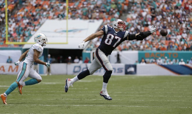 New England Patriots tight end Rob Gronkowski can't catch this pass during the game Sept. 7 as Miami Dolphins cornerback Brent Grimes covers.