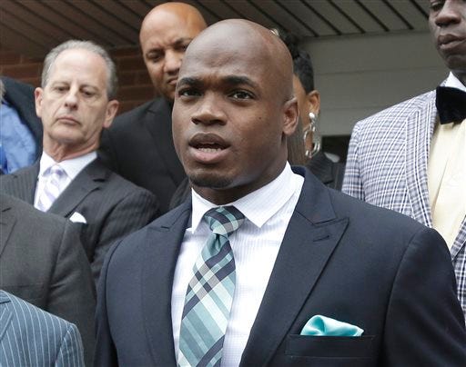 FILE - In this Nov. 4, 2014, file photo, Minnesota Vikings running back Adrian Peterson speaks to the media after pleading no contest to an assault charge in Conroe, Texas. On Friday, Dec. 12, 2014, the league-appointed arbitrator for Peterson's appeal affirmed his unpaid suspension until at least next spring, the final result of a child-abuse case that kept the Minnesota Vikings running back out of all but one game this season and widened the rift between the NFL and its players over the fairness of the disciplinary process.