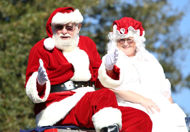 Santa and Mrs. Claus arrive on an Alachua County Fire Rescue truck at the annual City of Alachua Christmas Parade Dec. 13, 2014.