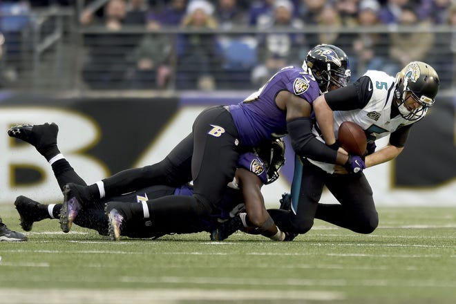 Jacksonville quarterback Blake Bortles (5) is sacked by Baltimore outside linebacker Terrell Suggs (55) during the second half Sunday in Baltimore.