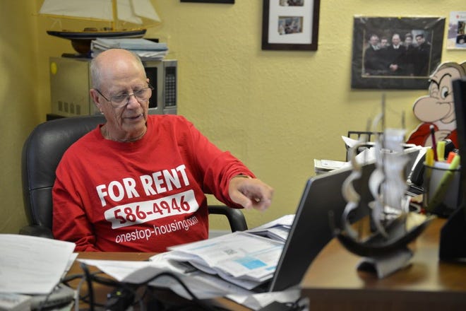 Harvey Vengroff works at his desk in the front lobby of an old hotel he converted into an apartment complex on Tamiami Trail in Sarasota.