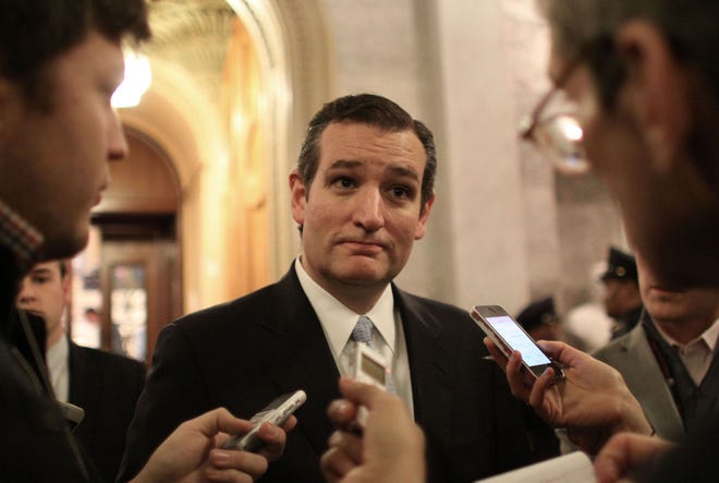 Sen. Ted Cruz, R-Texas, talks after the Senate voted to send a $1.1 trillion spending bill for President Barack Obama’s signature to fund the government through the next fiscal year.