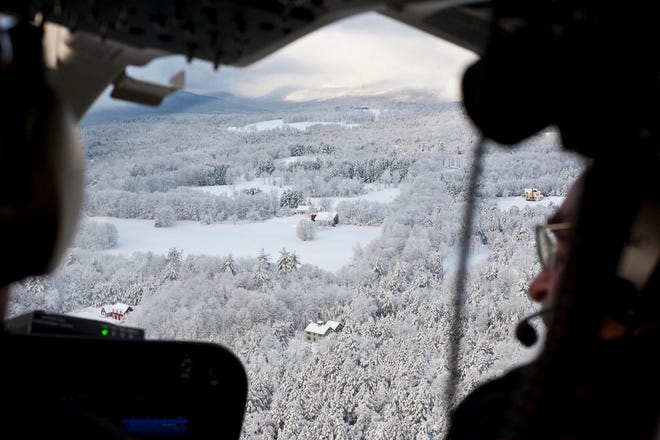 Gov. Peter Shumlin flies over Hinesburg, Vt., in a helicopter Saturday as he 
surveys the results of a storm that brought snow and power outages to much 
of the state.AP PHOTO / GLENN RUSSELL