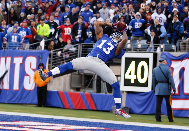 Giants wide receiver Odell Beckham catches a pass Sunday against the Washington Redskins during the fourth quarter of their game in East Rutherford, N.J. A flag was called on the play and the catch was not ruled a touchdown. THE ASSOCIATED PRESS