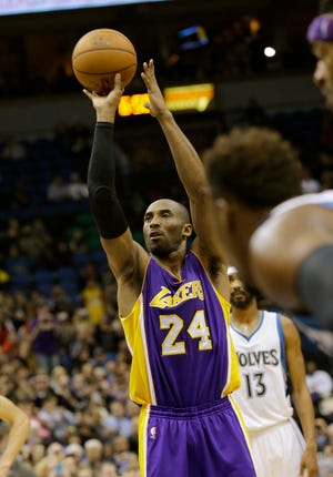 Lakers guard Kobe Bryant shoots a free-throw Sunday during the second quarter of a game against the Timberwolves in Minneapolis. Bryant passed Michael Jordan on the NBA all-time scoring list by making the shot. THE ASSOCIATED PRESS