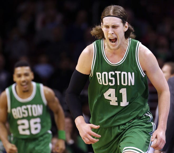 Celtics forward Kelly Olynyk shouts after hitting a 3-pointer during Boston's 105-87 win over the 76ers on Monday night.