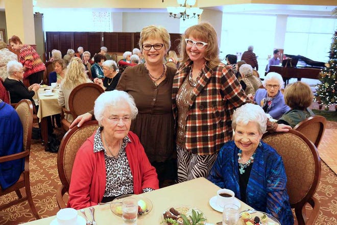 Neil Starkey / For the Amarillo Globe News; Pat Fisher, Cindy Todd, Pamela Pauling and Peggy Lindley enjoy a fashion show during the High Tea hosted by The Craig Retirement Community. November 21,2014