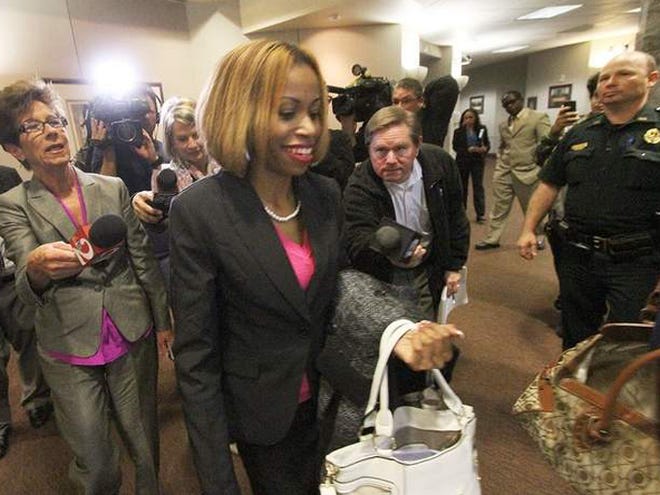 Ebony Wilkerson walks past members of the media Friday after being found not guilty by reason of insanity.