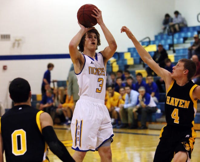 Nickerson's Austin O'Toole (3) takes a shot over Haven's Jacob Miller (4) and Tim Hendrixson (0) during the first half of their game on Tuesday, Dec. 16, 2014, in Nickerson.