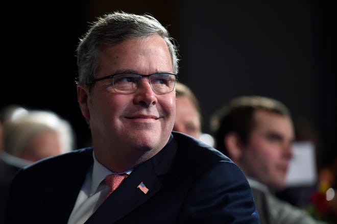In this Nov. 20, 2014, photo, former Florida Gov. Jeb Bush listens before speaking at the National Summit on Education Reform in Washington. Bush on Tuesday took his most definitive step yet toward running for president, announcing plans to "actively explore" a campaign and form a new political operation allowing him to raise money for like-minded Republicans.