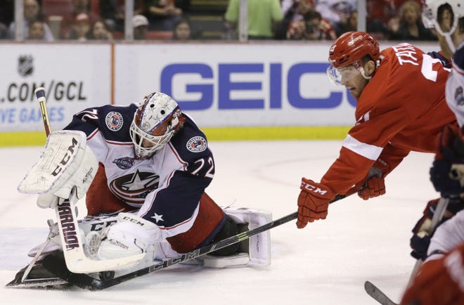 Blue Jackets goalie Sergei Bobrovsky stops a shot by Red Wings left wing Tomas Tatar during the second period in Detroit.