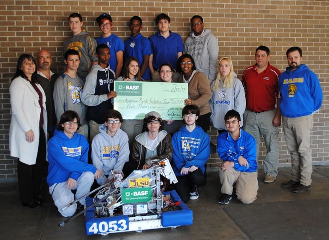 BASF employee volunteers and student mentors present the Robot Ascension team with a $5,000 donation. Top row from left: Robot Ascension team members Zack Lebeau, Don Hidalgo, Marcus Barnes, Ryan Stelly, and Tyrus Rodrigue. Middle row from left: Theresa Ordeneaux (BASF employee volunteer and student mentor) Shane Dugas (BASF employee volunteer and student mentor), and Robot Ascension team members William Demourelle, Mack Allen, Aiden Reed, Kaci Breaux, Susan Allen, and Sarah Hughey; Alan Smith (BASF employee volunteer and student mentor), and Phil Blanchard (Robot Ascension team leader). Bottom row from left: Robot Ascension team members Hunter Ordeneaux, Kyle Arant, Cameron Simmerman, Logan Ford, and Lee Faught.