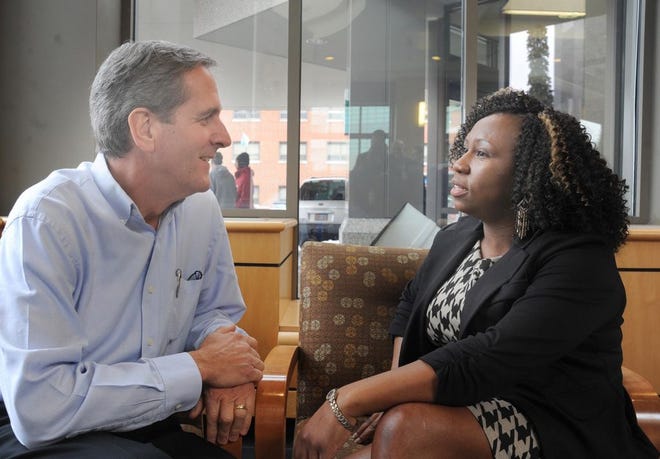 John Lyons talks to Kenisha Starks at Charlton Memorial Hospital on Wednesday. Starks, a Certified Nursing Assistant, performed CPR on Lyons after he suffered a heart attack while running on a treadmill, and she's credited with helping save his life.