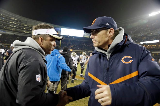 New Orleans Saints head coach Sean Payton and Chicago Bears head coach Marc Trestman talks after an NFL football game Monday, Dec. 15, 2014, in Chicago. The Saints won 31-15.